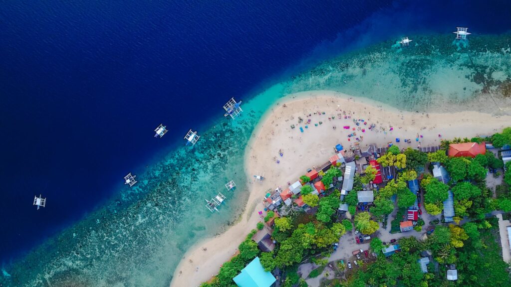 Aerial View of a Shore and Body of Water