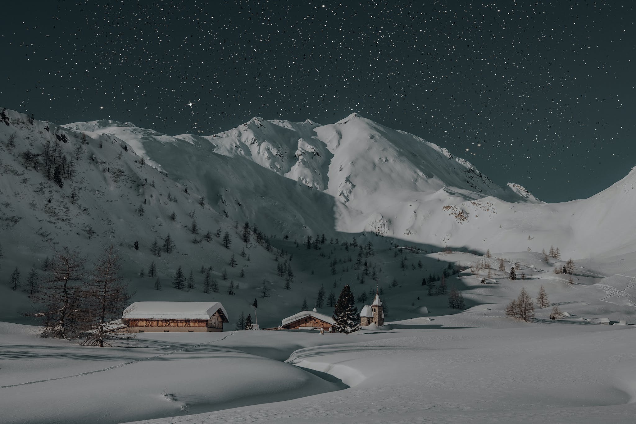 Two Brown Houses Covered With Snow